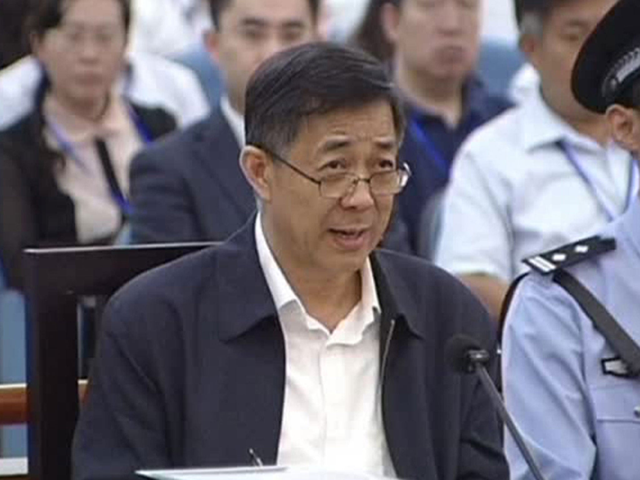 Ousted senior Chinese politician Bo Xilai speaks during his trial in Jinan, Shandong province