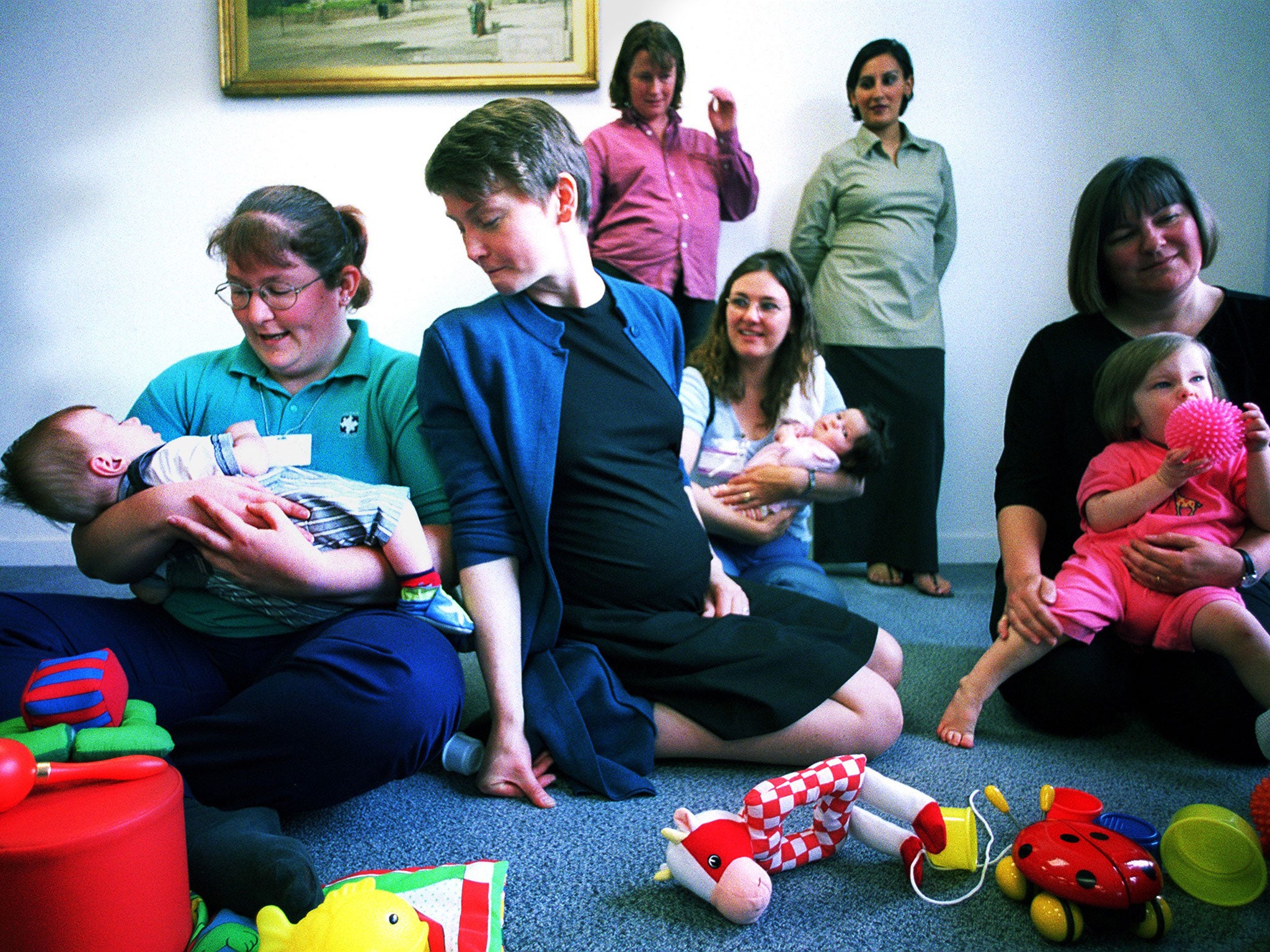 Yvette Cooper visiting a creche for delegates at a maternity care conference while pregnant with second son Joel