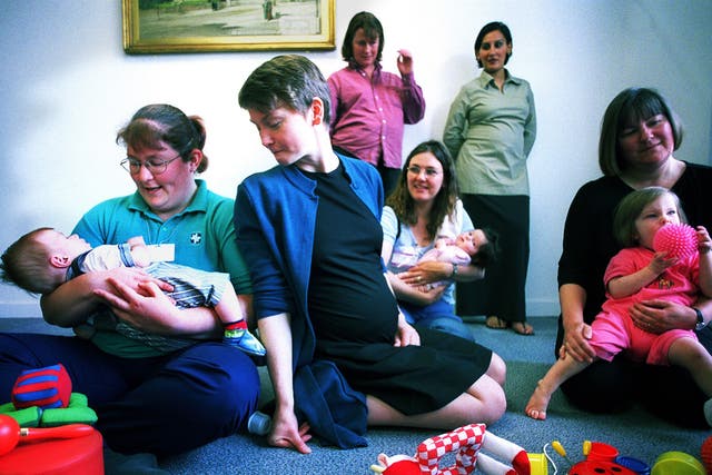Yvette Cooper visiting a creche for delegates at a maternity care conference while pregnant with second son Joel