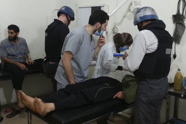 U.N. chemical weapons experts visit people affected by an apparent gas attack