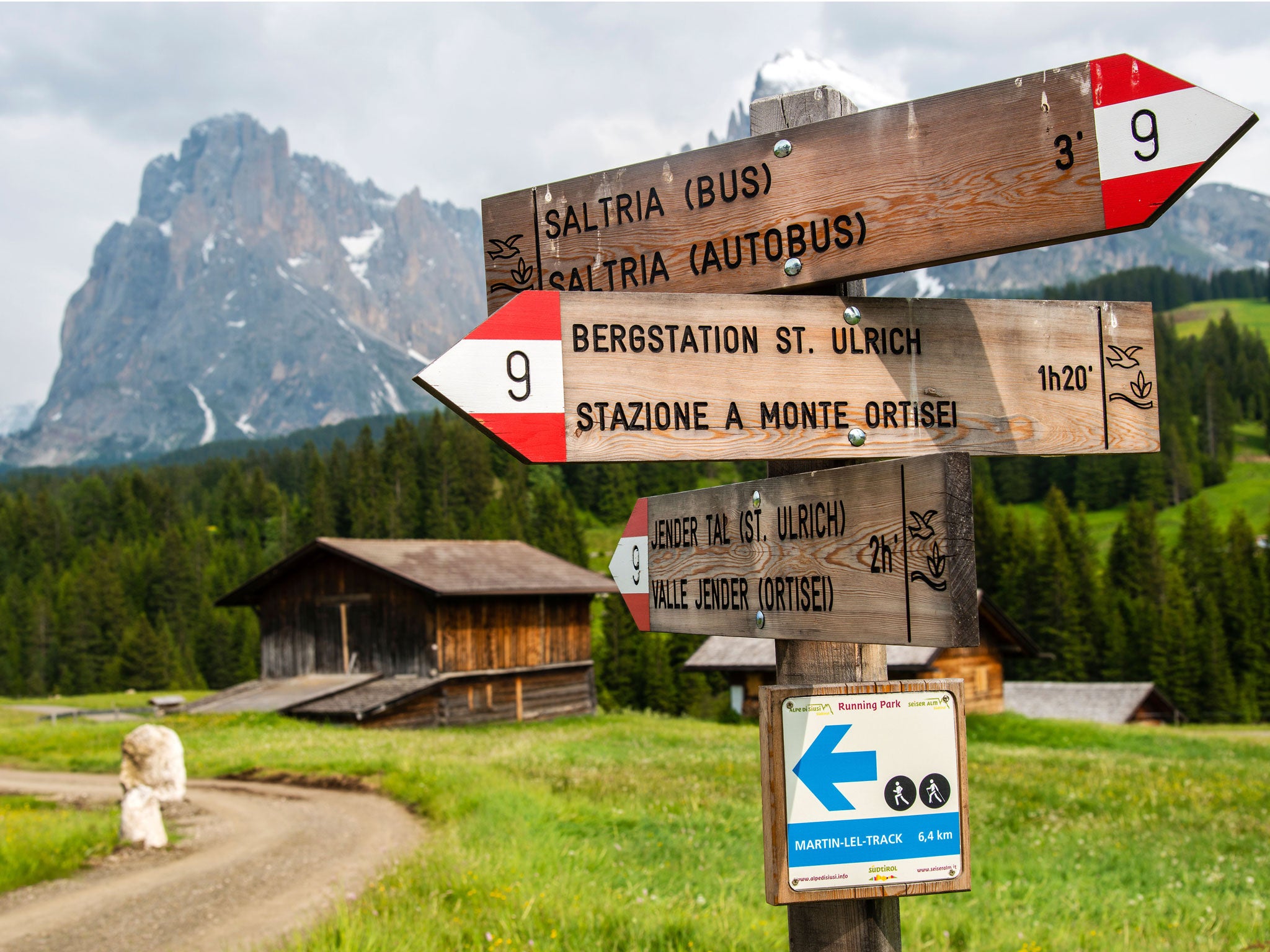 South Tyrol's governor wants to get rid of bilingual signs like these on a hiking trail in the Dolomites