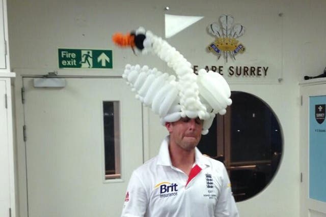 Swann dons a swan balloon hat