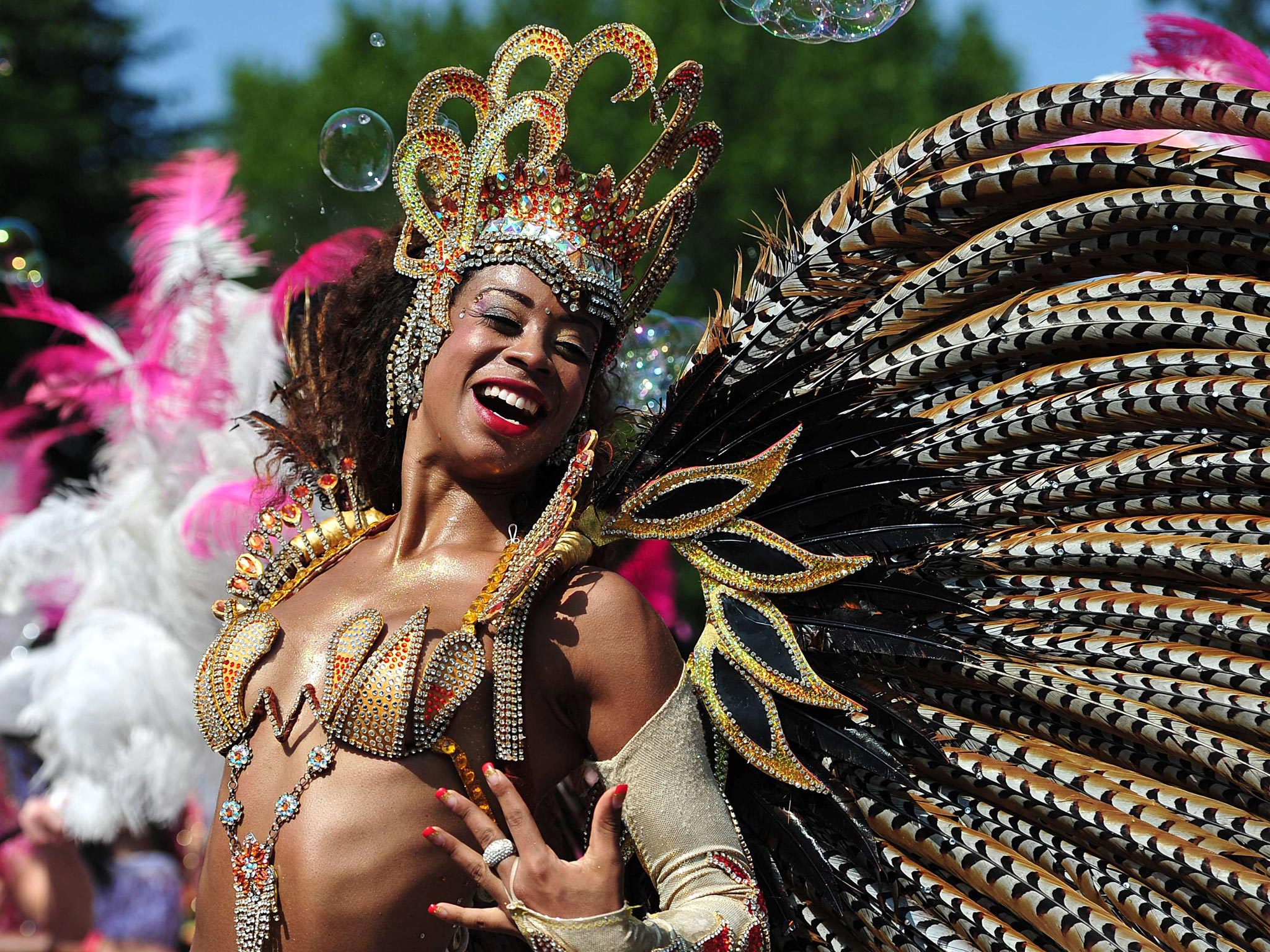 A performer takes part in the parade on the second day of the Notting Hill Carnival in west London