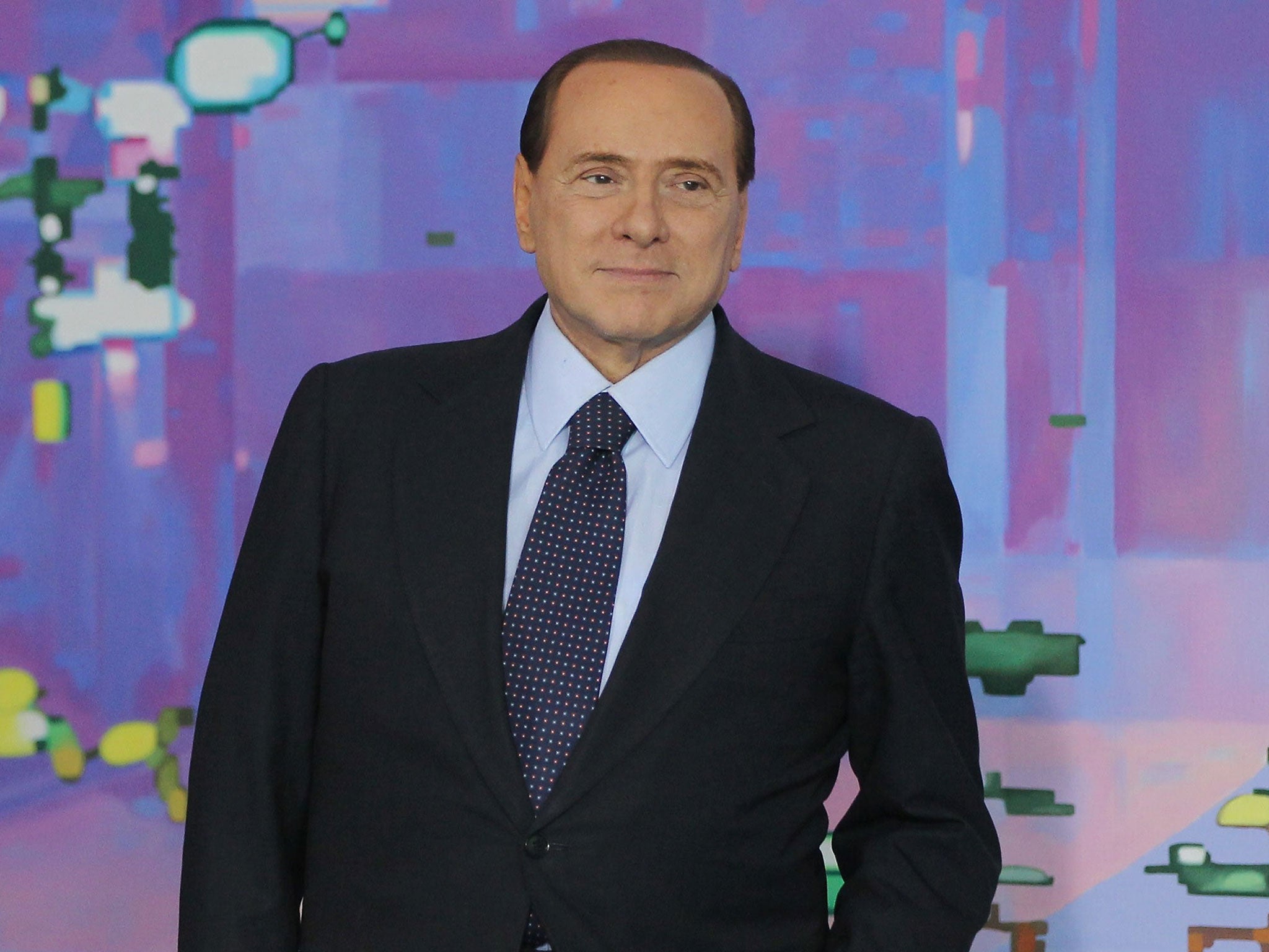 The former Italian premier, Silvio Berlusconi, has called off his political attack dogs
