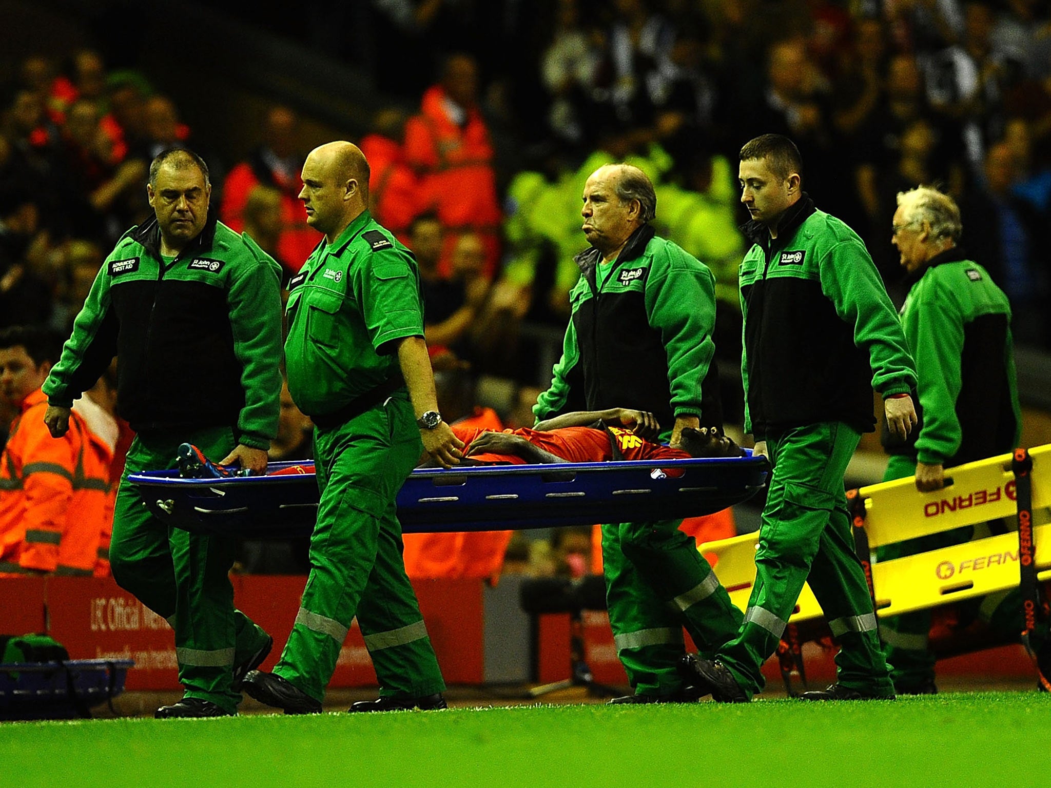 Kolo Toure of Liverpool is stretchered off during the Capital One Cup Second Round between Liverpool and Notts County at Anfield