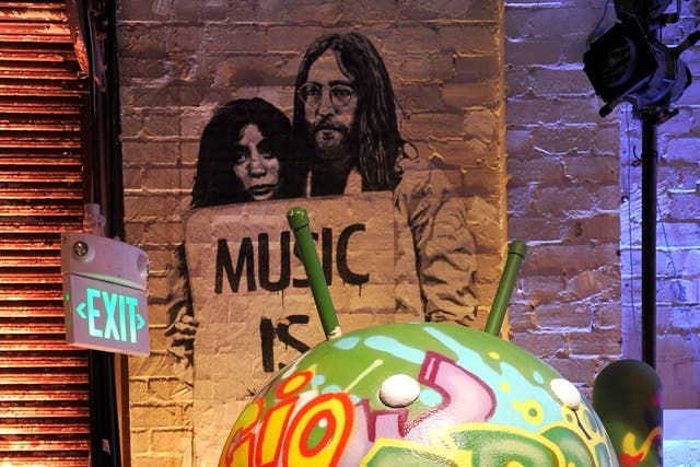 Google's Android mascot is shown decorated for the launch of Google Music in 2011. 