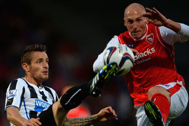 Mathieu Debuchy of Newcastle and Morecambe's Kevin Ellison