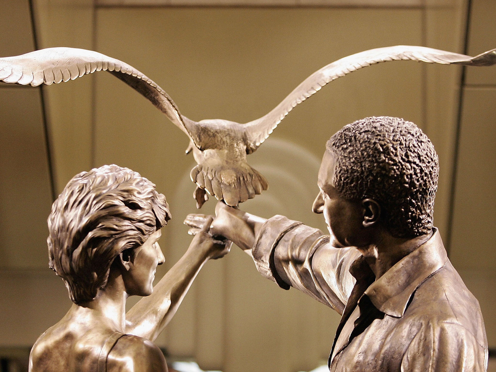 A statue of Diana, Princess of Wales and Dodi Al Fayed is unveiled at Harrods department store on 1 September, 2005 in London.
