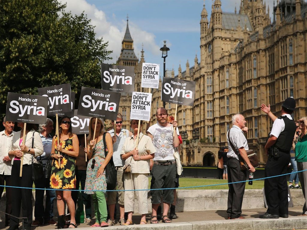 Protesters gather outside the Houses of Parliament yesterday