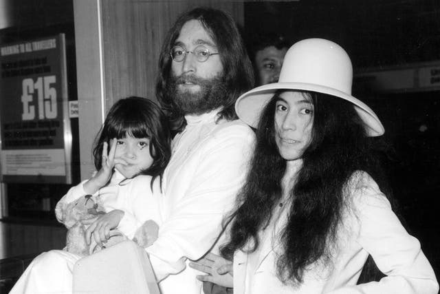 Yoko Ono with John Lennon at London's Heathrow airport in 1969. With them is Kyoko, Yoko's daughter from her previous marriage