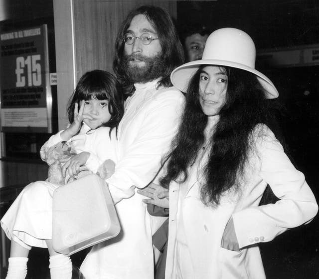 Yoko Ono with John Lennon at London's Heathrow airport in 1969. With them is Kyoko, Yoko's daughter from her previous marriage