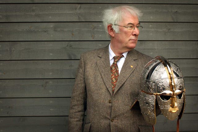 Author of the acclaimed translation of Beowulf, Seamus Heaney holds a replica of the Sutton Hoo helmet 