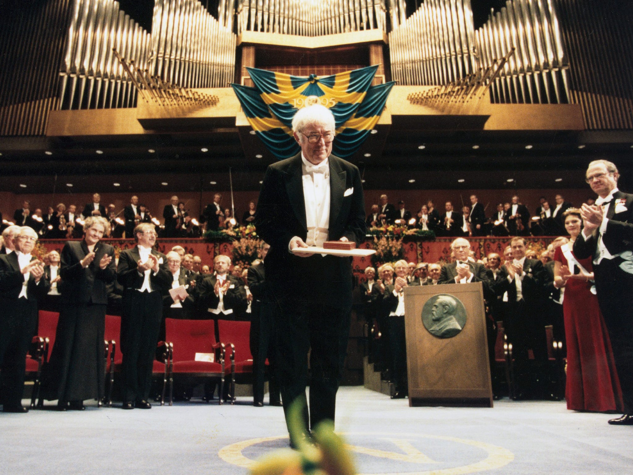 Seamus Heaney poses with the Nobel Prize for Literature he received during the Nobel ceremonies in Stockholm on 10 December 1995