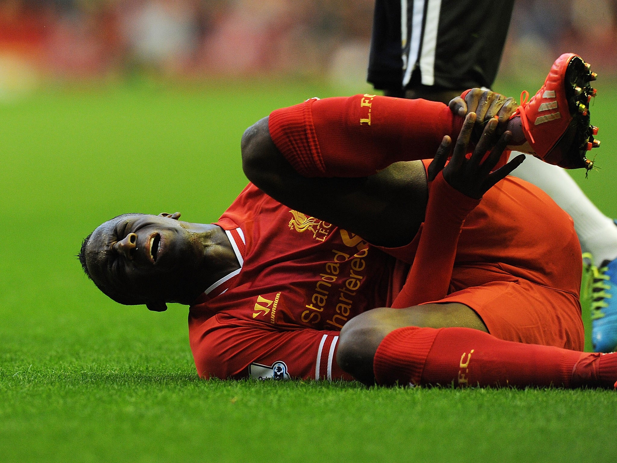 Aly Cissokho goes down injured in the Capital One Cup
