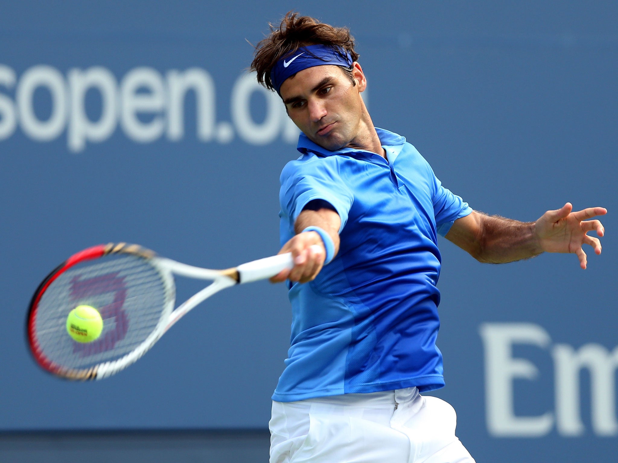 NEW YORK, NY - AUGUST 29: Roger Federer of Switzerland returns a shot during his men's singles second round match against Carlos Berlocq of Argentina on Day Four of the 2013 US Open at USTA Billie Jean King National Tennis Center. GETTY IMAGES