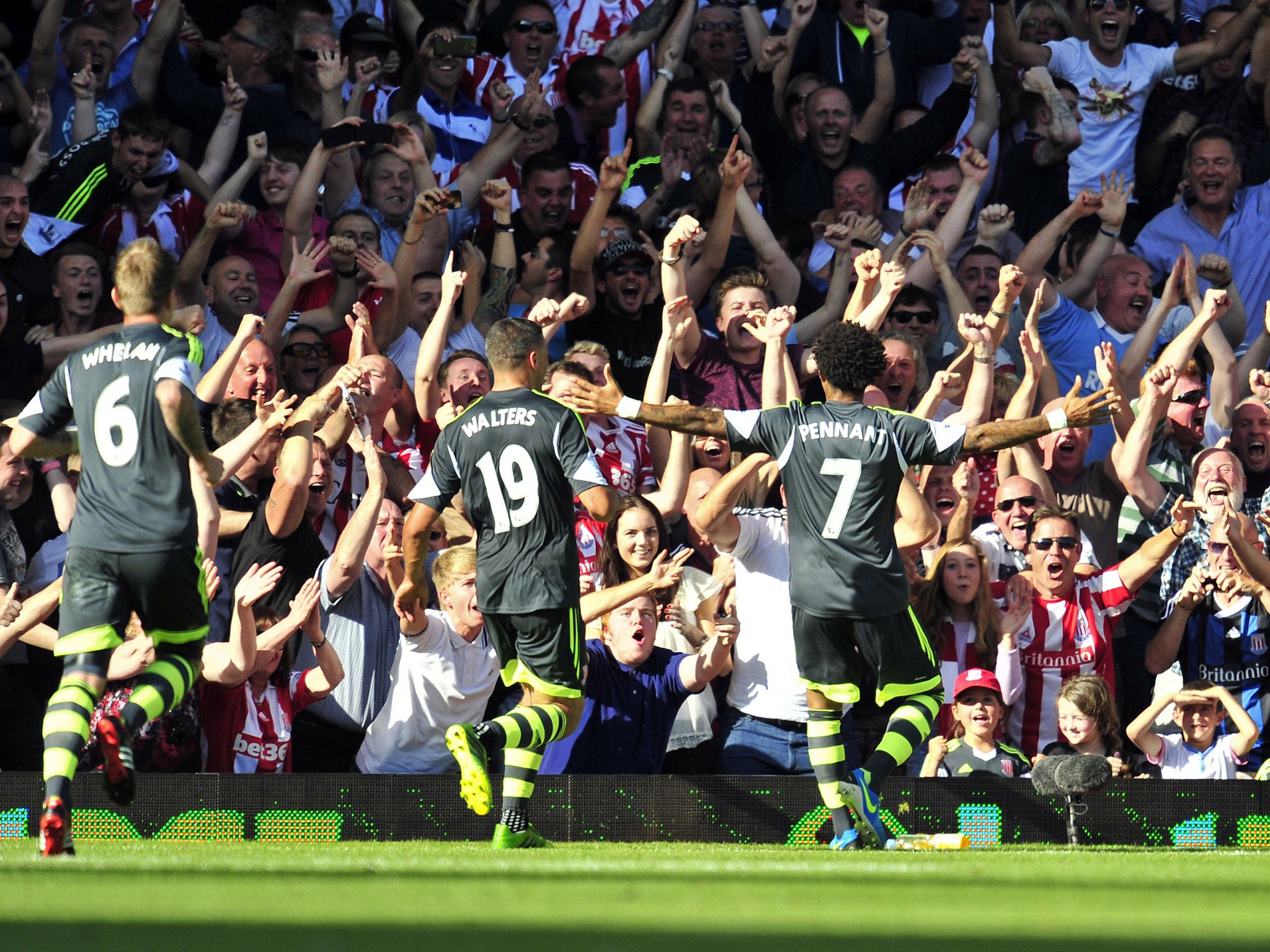 Stoke City's English midfielder Jermaine Pennant (R) celebrates scoring his goal