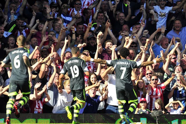 Stoke City's English midfielder Jermaine Pennant (R) celebrates scoring his goal