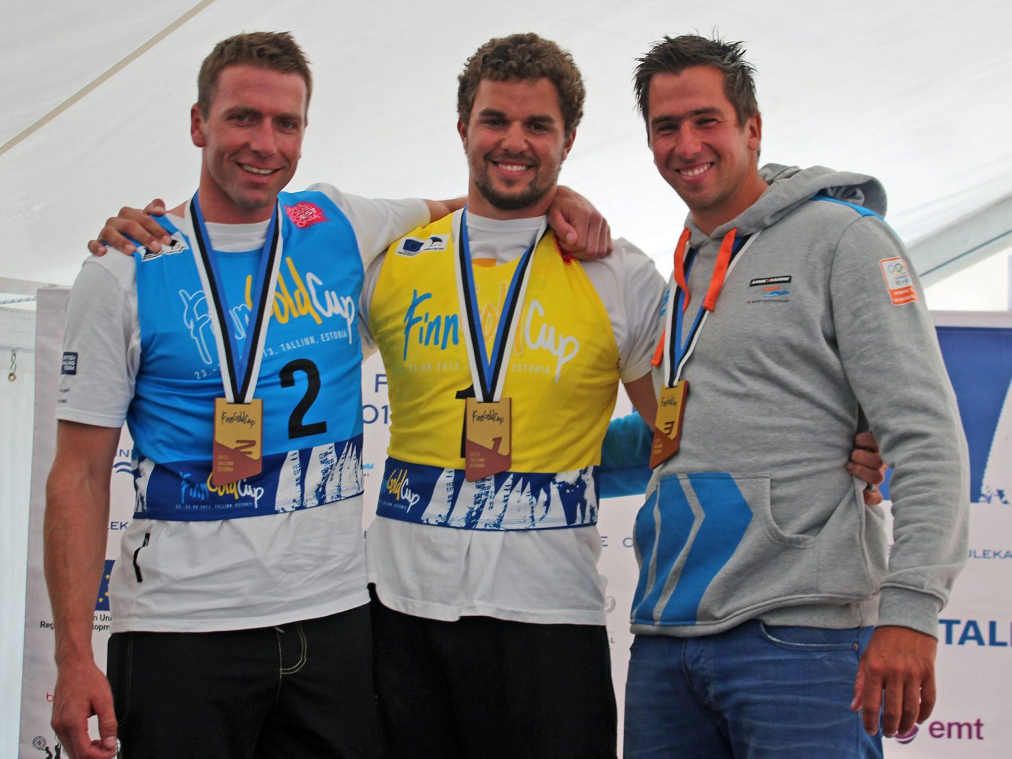 Britain’s Ed Wright (left), silver medallist in the Finn Gold Cup, joins winner Jorge Zarif of Brazil (centre) and bronze medallist Jan-Pieter Postma of the Netherlands on the podium in Tallinn, Estonia.