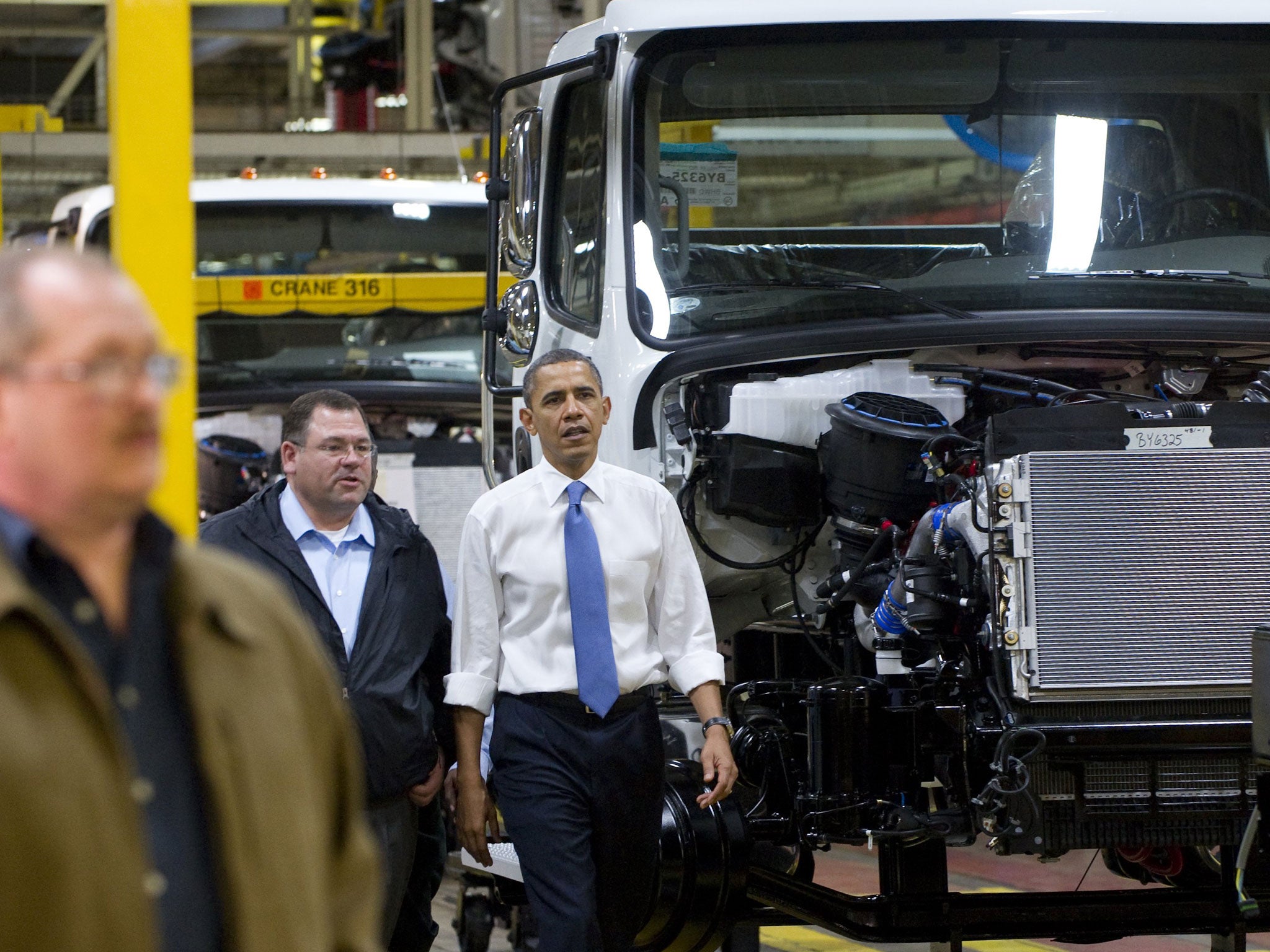 President Obama, here touring a truck factory, will soon have to turn his attention to the US economy