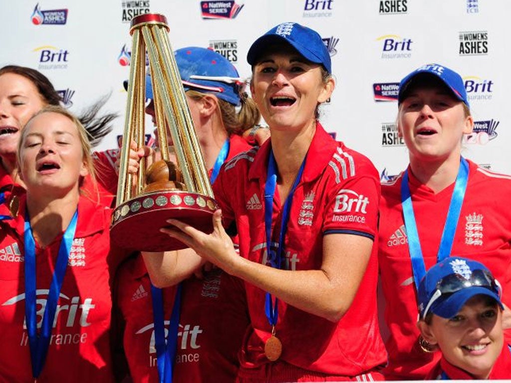 Well urned: England captain Charlotte Edwards displays the Ashes trophy