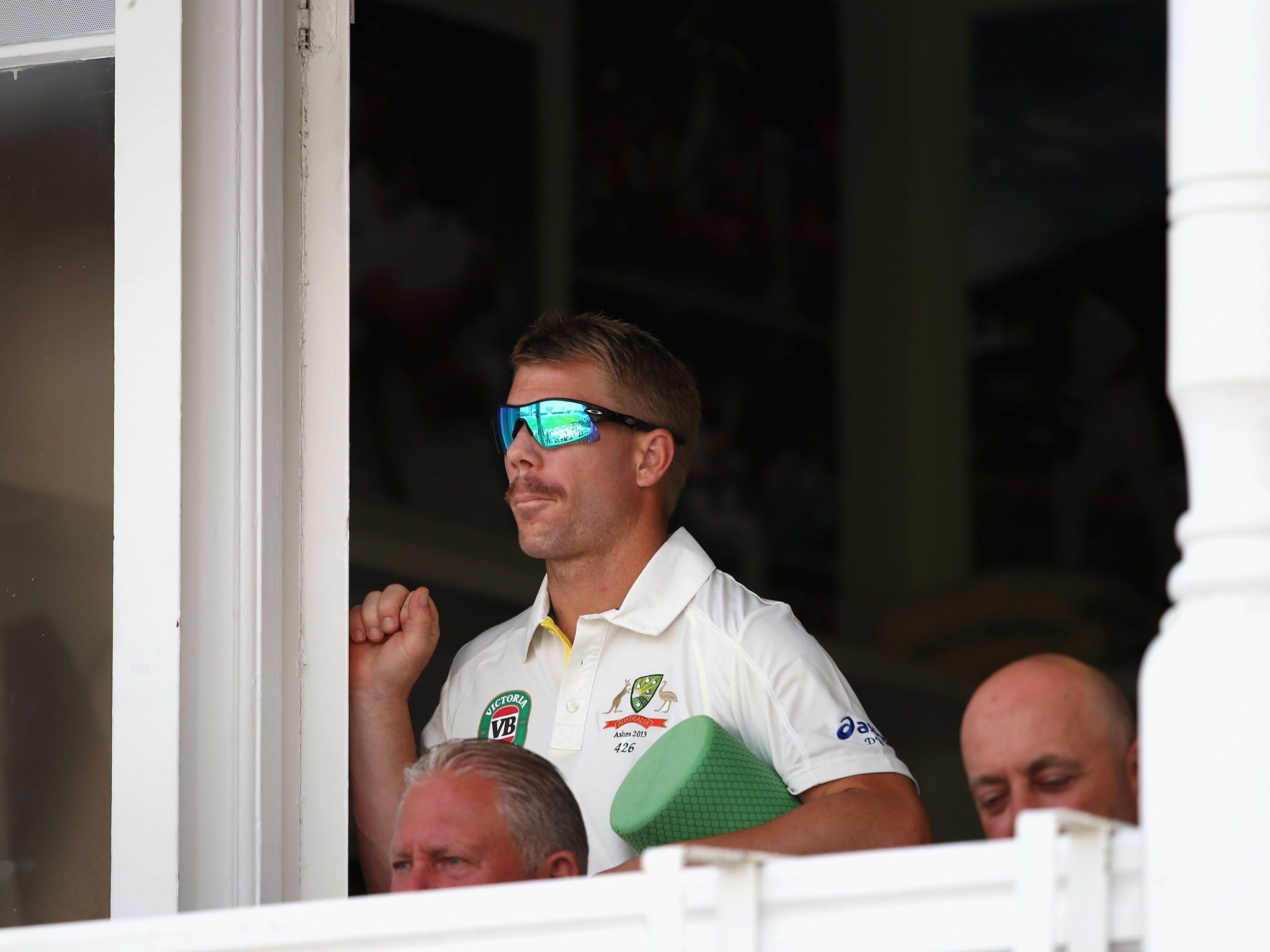 David Warner of Australia looks on during day three of the 1st Investec Ashes Test match between England and Australia