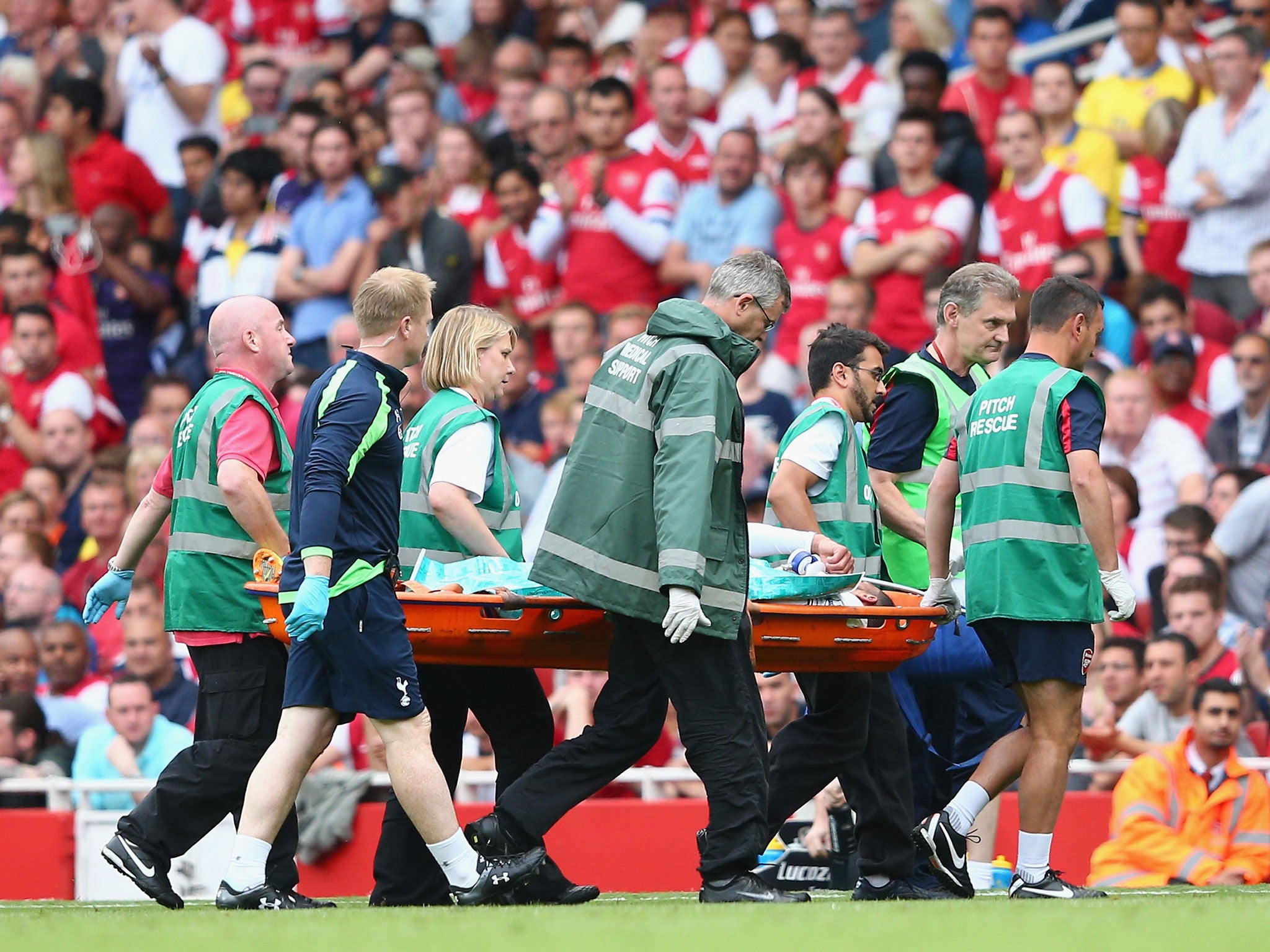 Etienne Capoue of Spurs is stretchered off