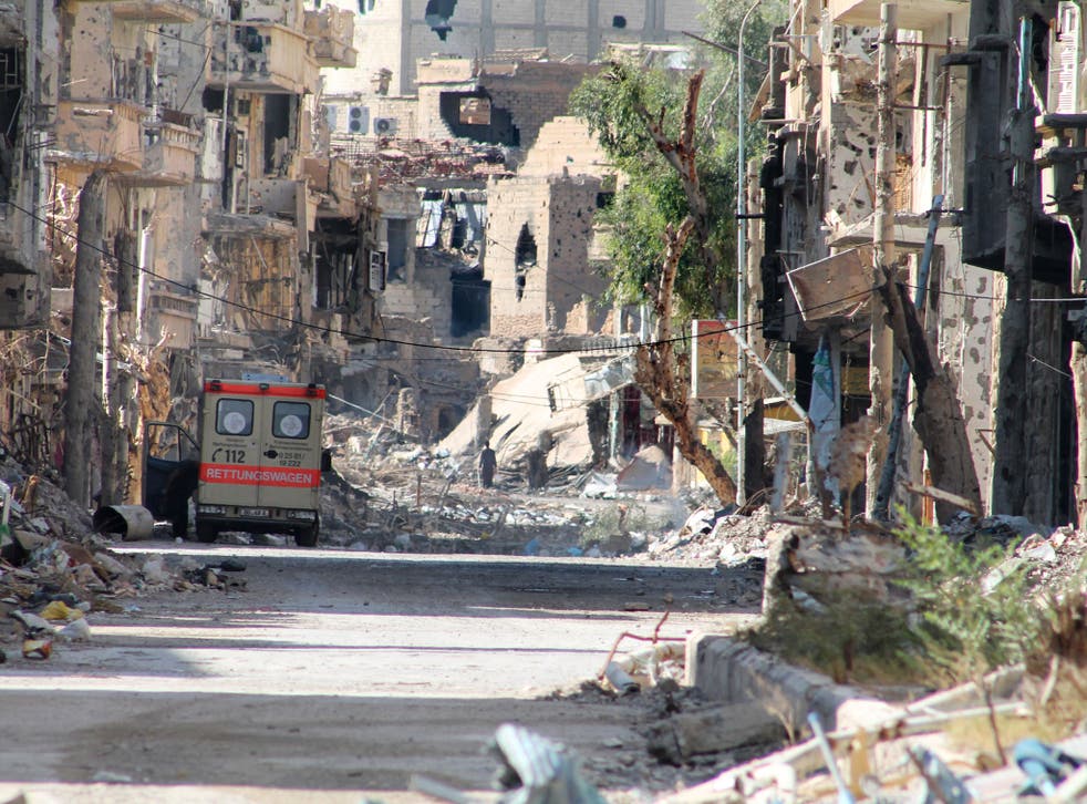A general view shows a heavily damaged street in Syria's eastern town of Deir Ezzor on August 26