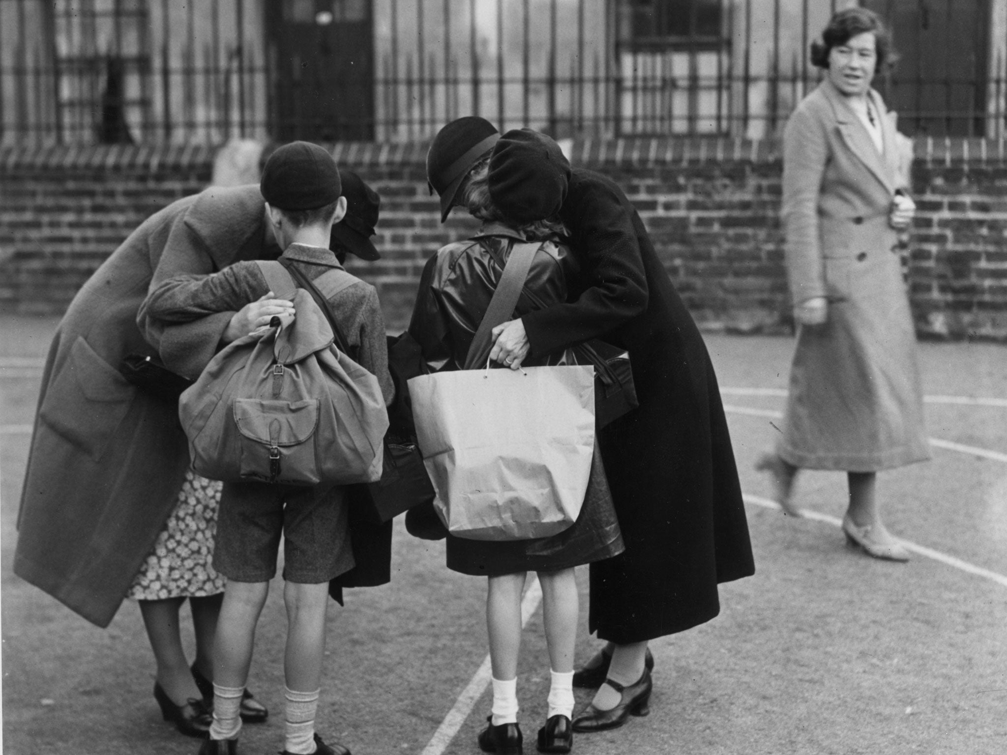 Kissing their children goodbye at St George's School, Notting Hill Gate, London, 1939