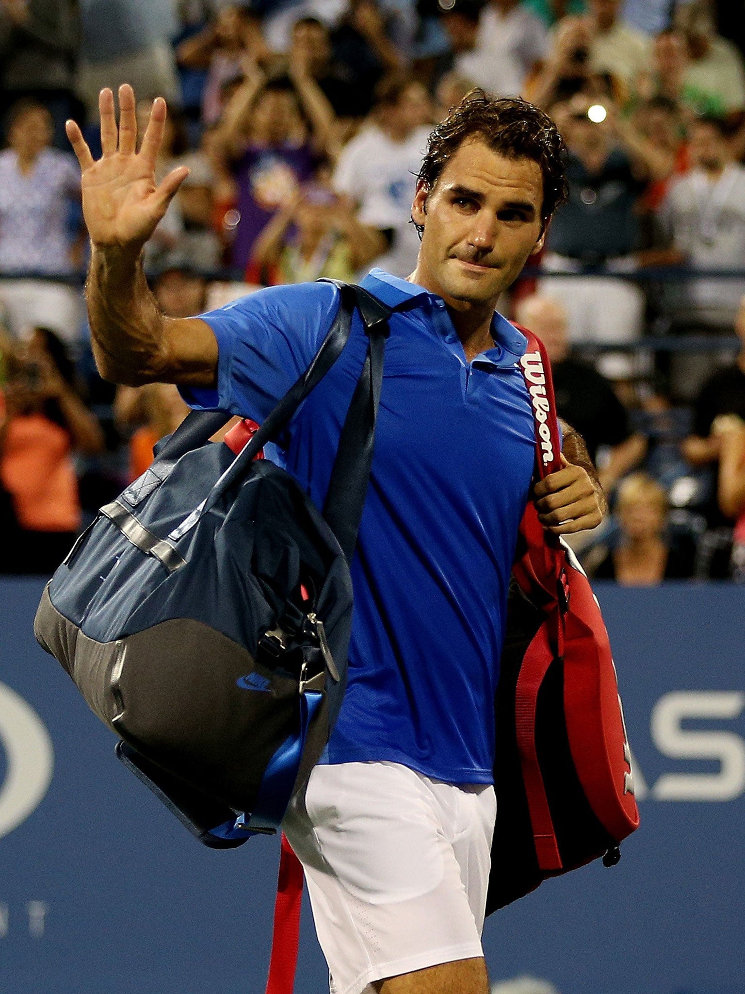 Roger Federer waves goodbye to the Flushing Meadows crowd after the latest defeat in his least successful year since 2002
