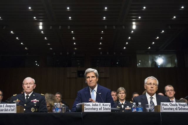 Left to right, Chairman of the Joint Chiefs Gen. Martin Dempsey, Secretary of State John Kerry and Defence Secretary Chuck Hagel testify during a Senate Foreign Relations Committee hearing on military intervention in Syria, 3 September 2013