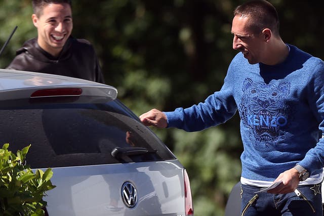 French forward Franck Ribery (R) speaks with midfielder Samir Nasri at the French national football team training base in Clairefontaine