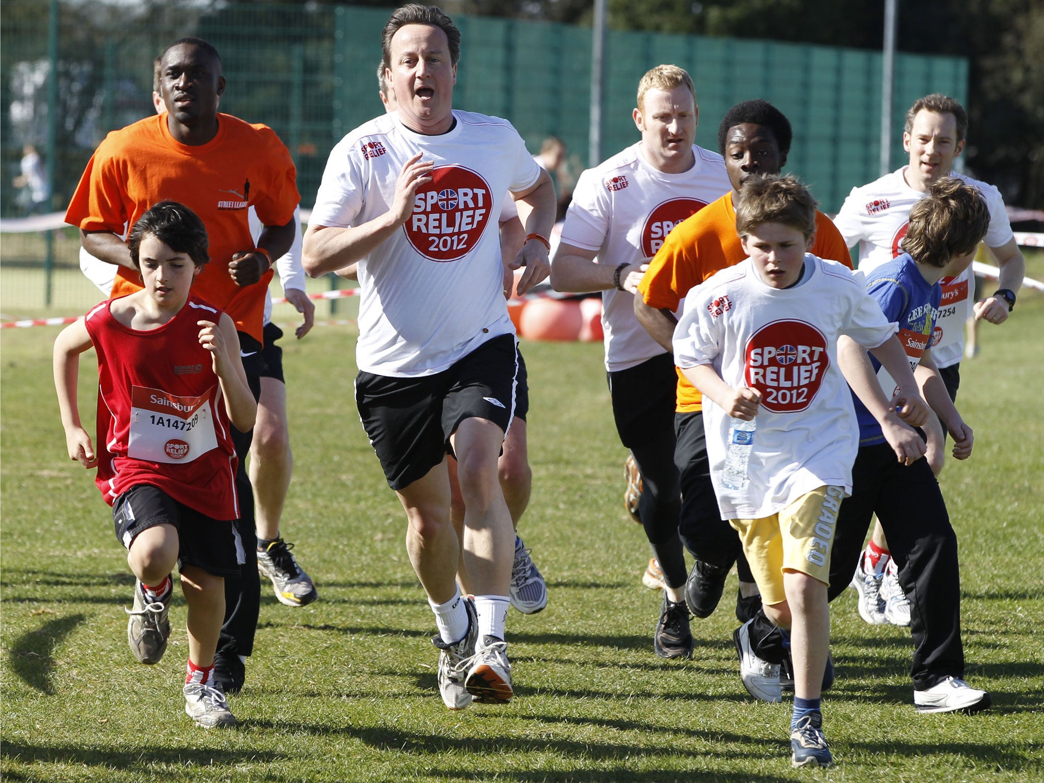 David Cameron, (C) runs a mile race for Sports Relief charity, 2012
