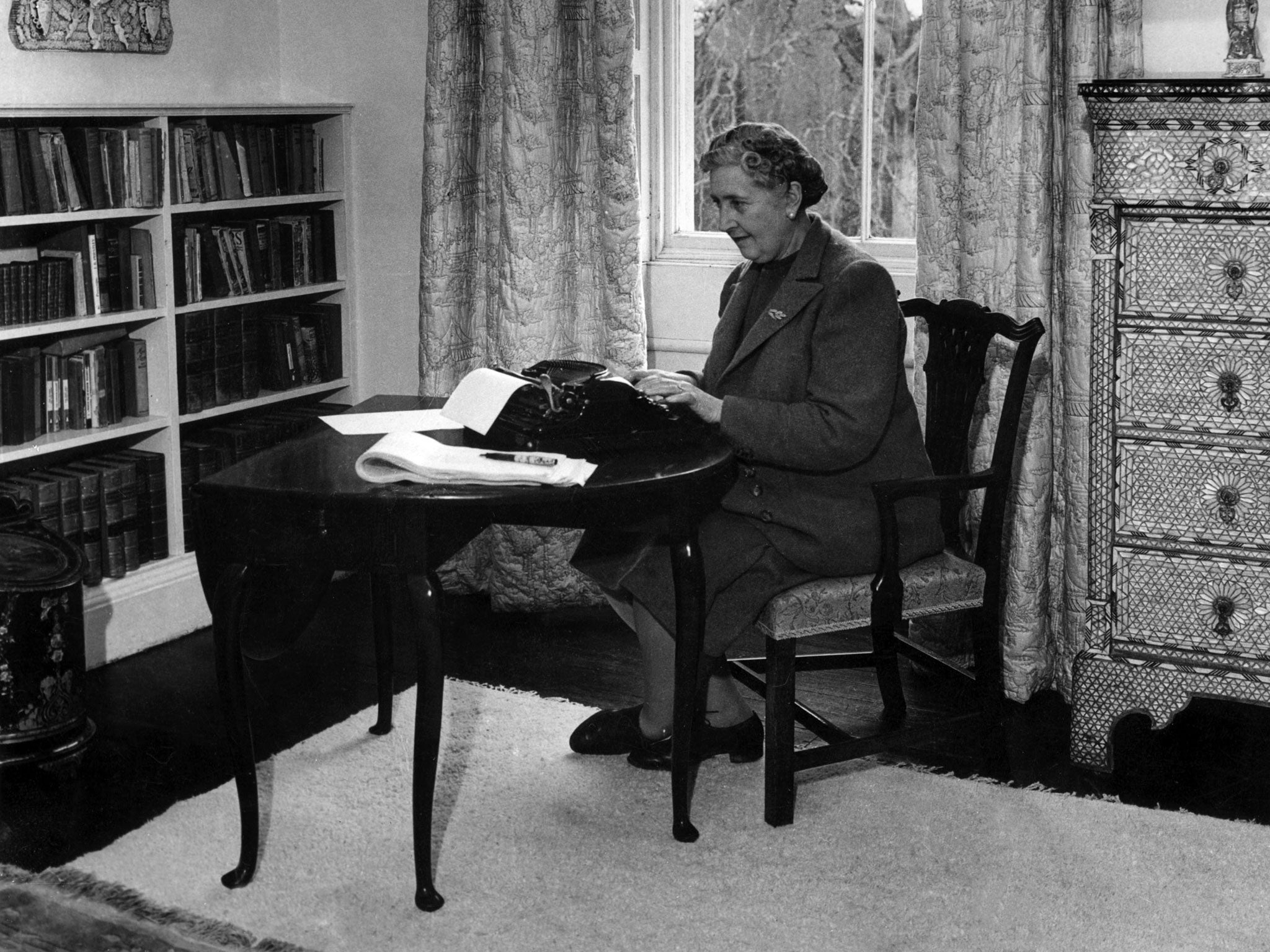 Dame Agatha Christie, at work on a typewriter in March 1946 in her home, Greenway House, in Devonshire.