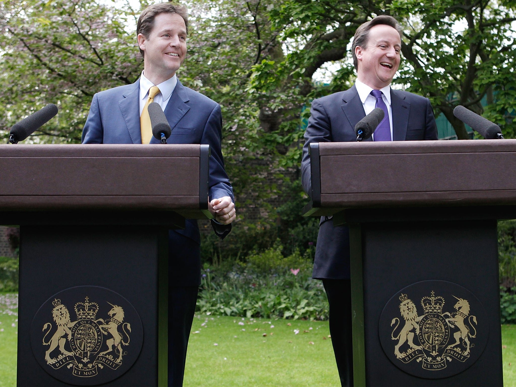 Nick Clegg and David Cameron: Their ties showed party colours, but the PM and his deputy otherwise matched outfits in the heady days of the Coalition honeymoon. They wore navy suits during their garden press conference in 2010, but have taken more individual approaches since.