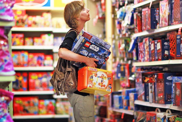 A shopper browses a Toys R Us store