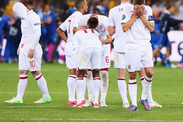 English players react to their Euro 2012 penalty shootout defeat against Italy 