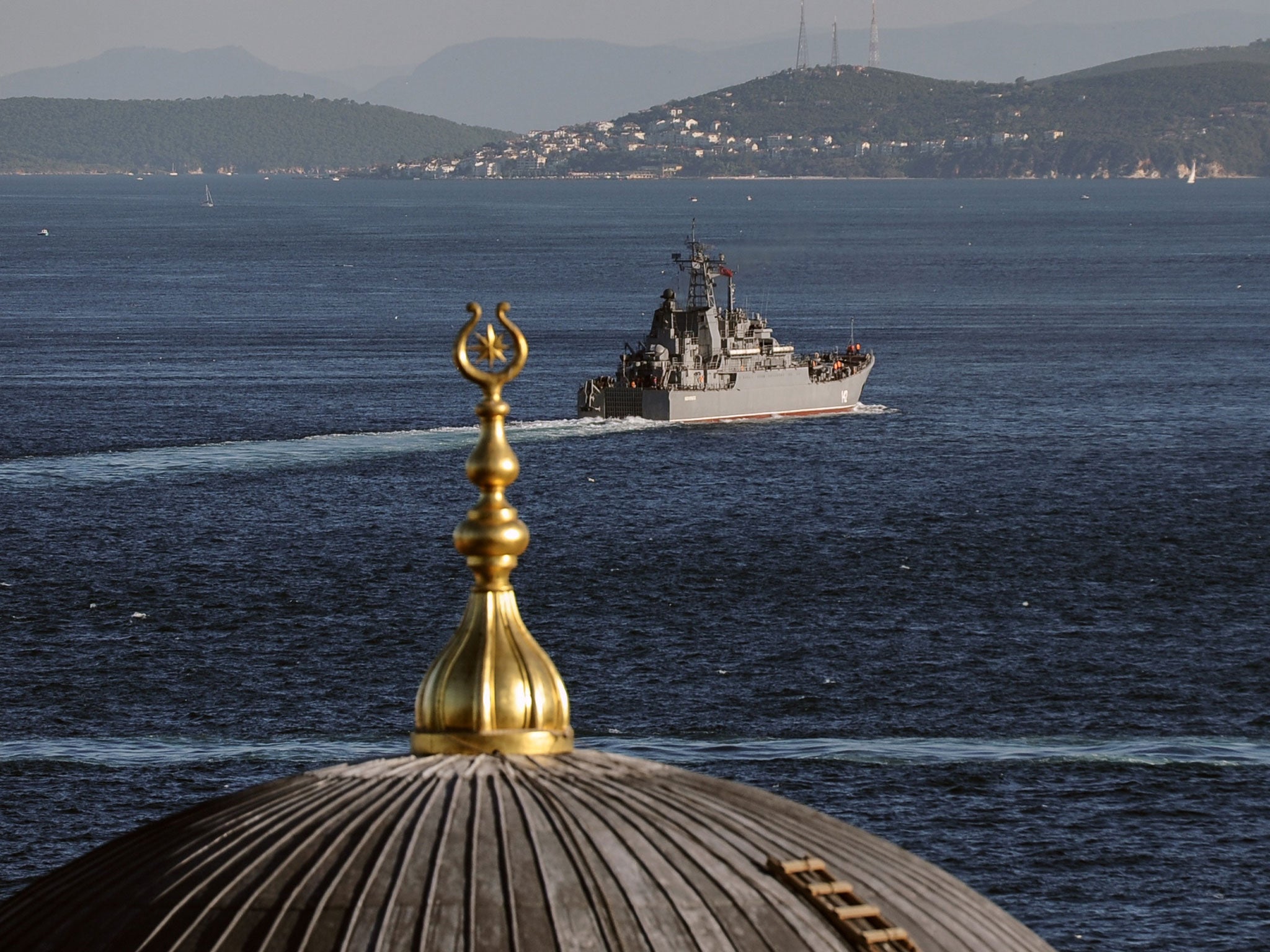 A Russian warship sails through the Bosporus in Istanbul. A group of Russians warships are en route to the East Mediterranean