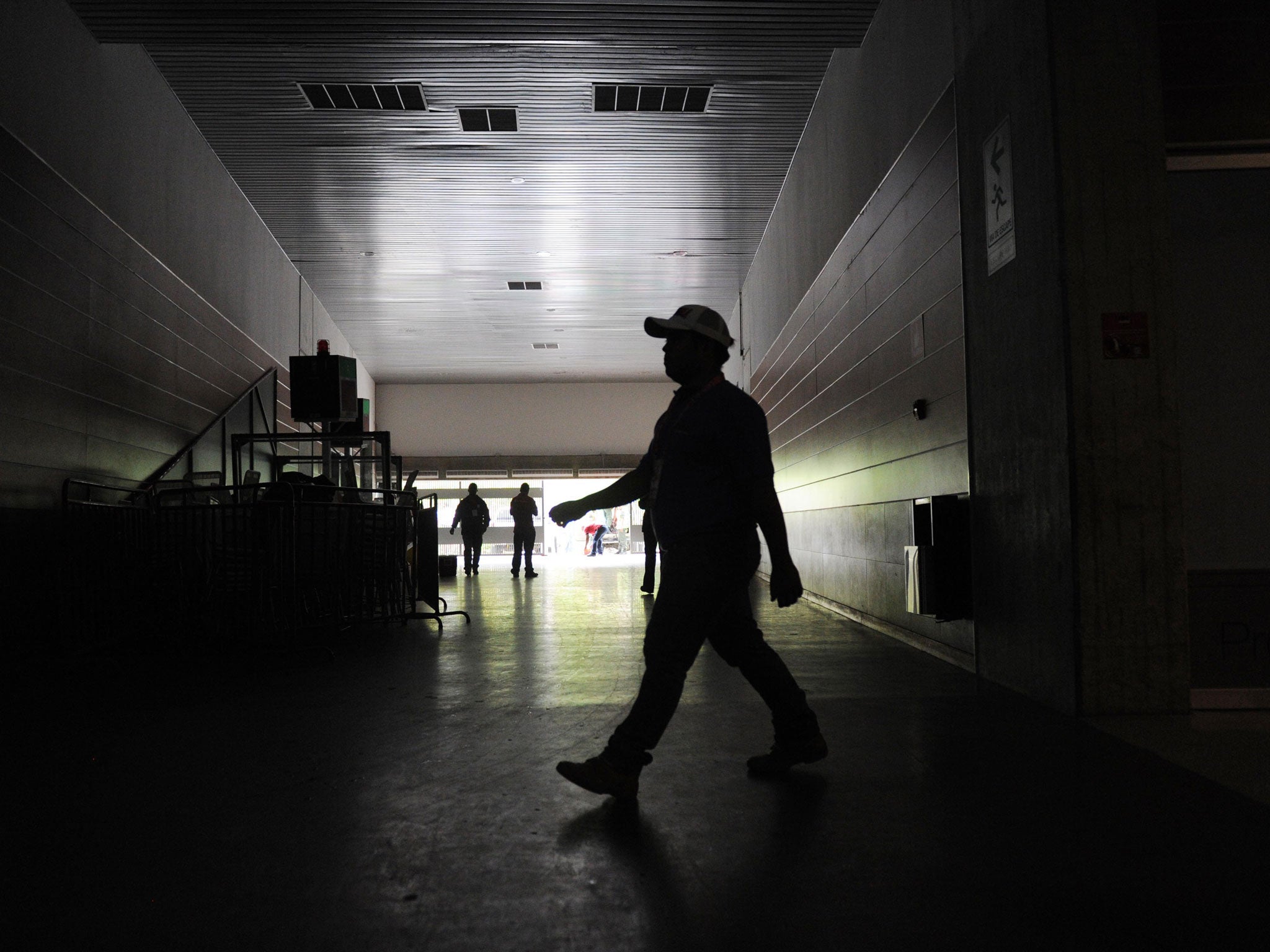 A man walks at the Poliedro stadium in Caracas
