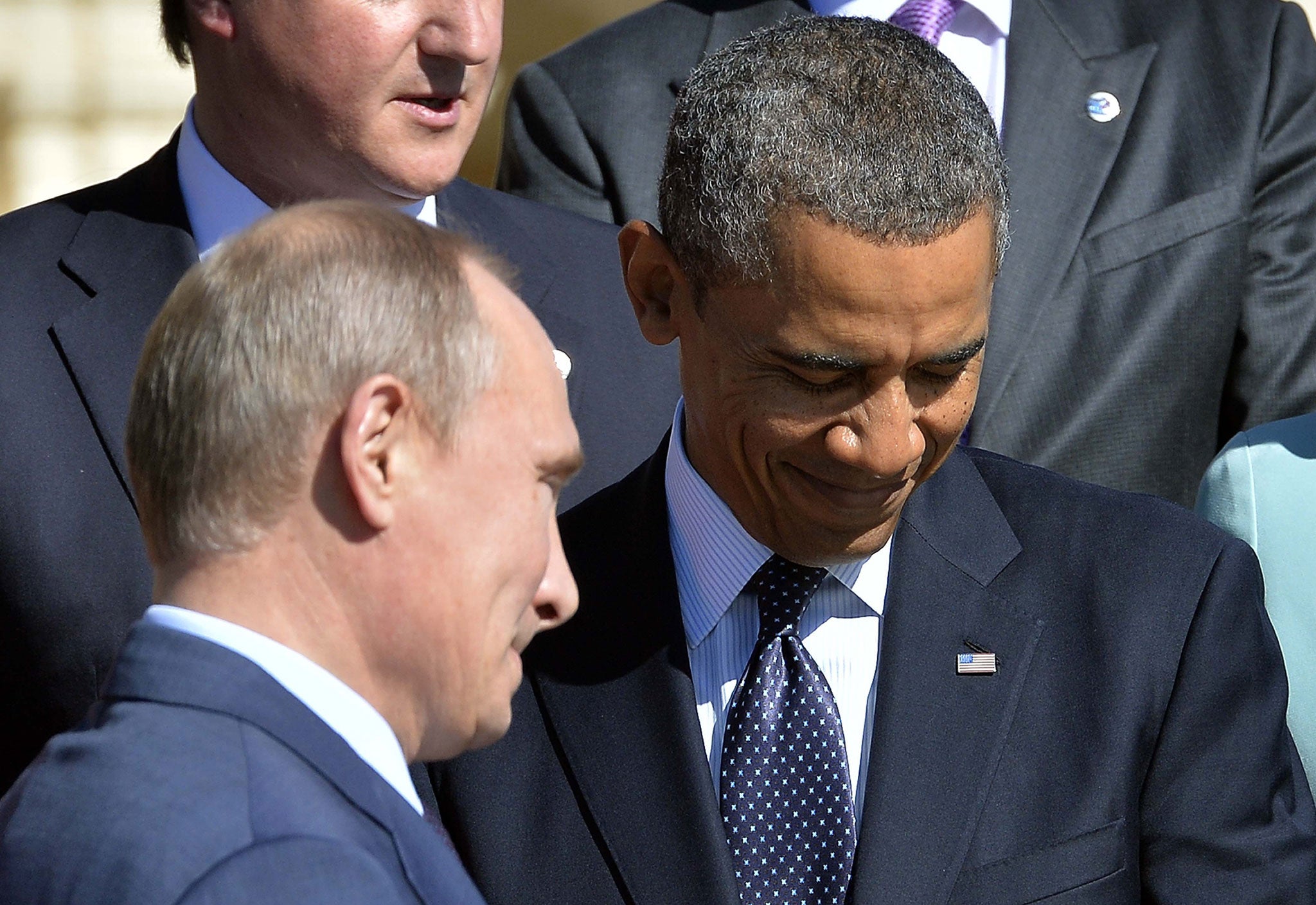 Obama forces a smile at the G20 with Vladimir Putin