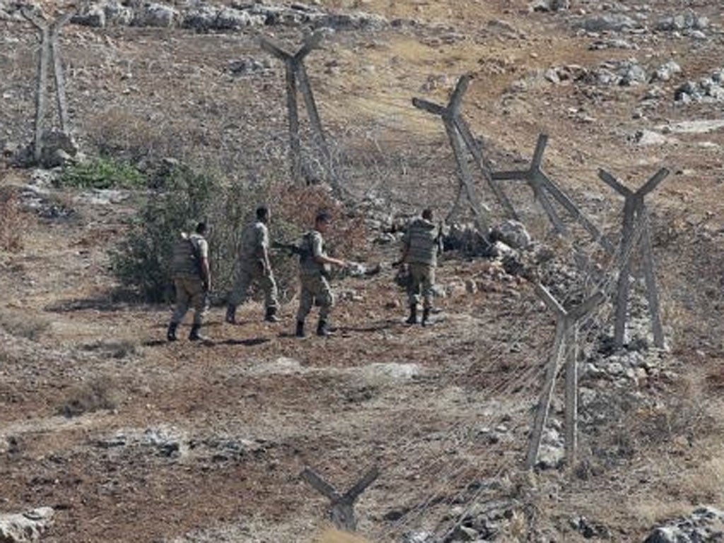 Turkish soldiers patrol the Turkish-Syrian border near Cilvegozu