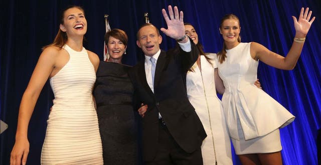 Tony Abbott stands with his family as he claims victory in Australia's federal election