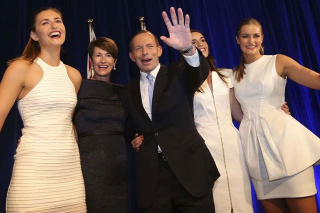 Tony Abbott stands with his family as he claims victory in Australia's federal election