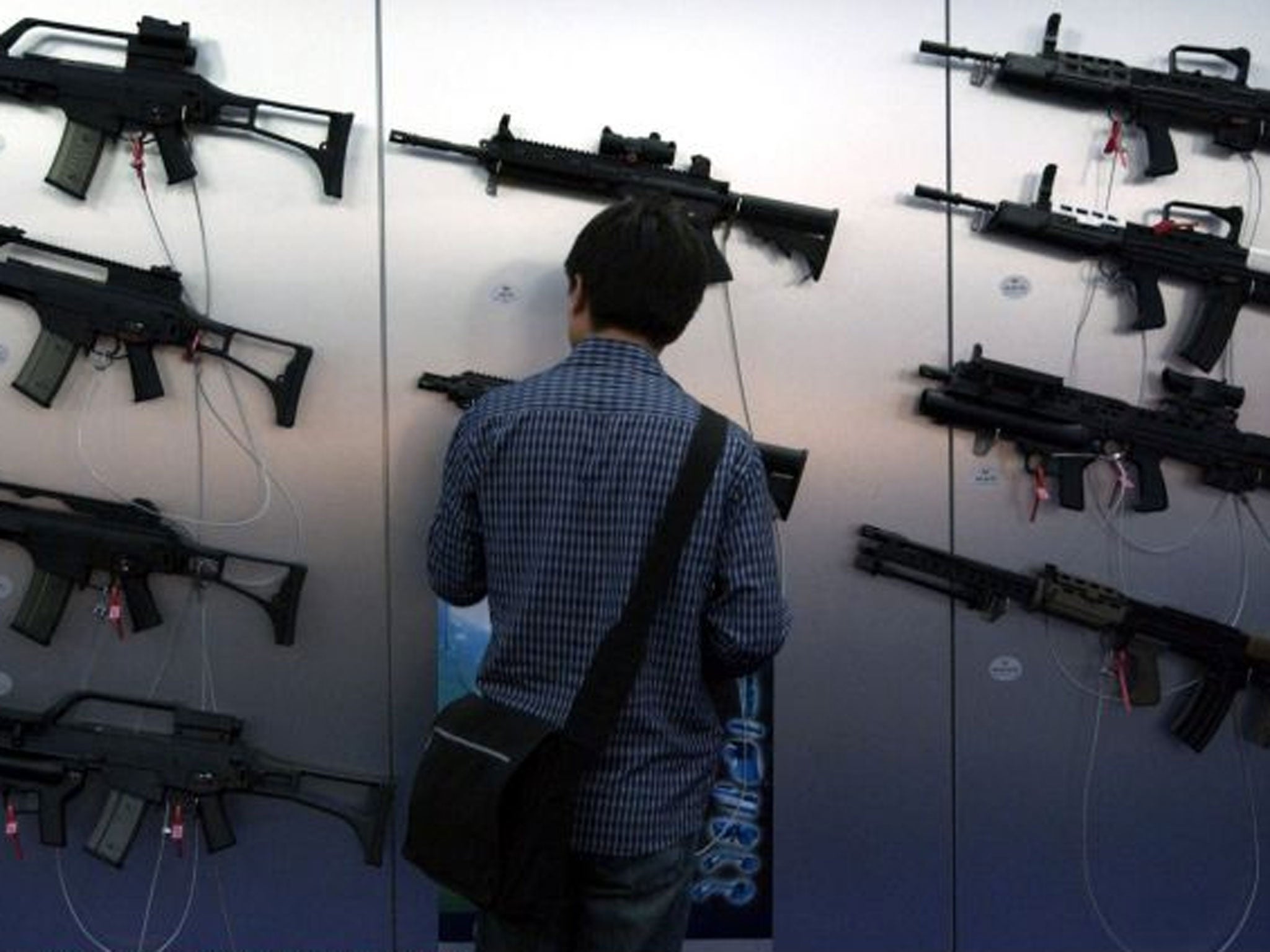 Guns for sale: Browsing at a previous DSEi arms show