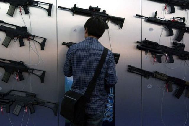 Guns for sale: Browsing at a previous DSEi arms show