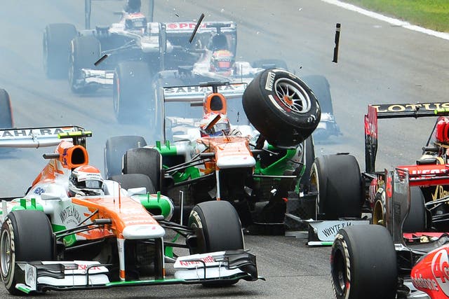 Force India’s Paul di Resta, centre, crashes into Romain Grosjean’s Lotus at Monza