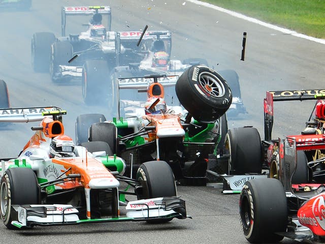 Force India’s Paul di Resta, centre, crashes into Romain Grosjean’s Lotus at Monza