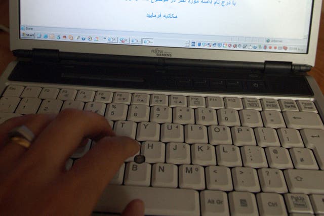 File: An Internet user tries to log onto Facebook in Tehran. A message in Farsi reads "Dear subscriber, access to this site is not possible...."