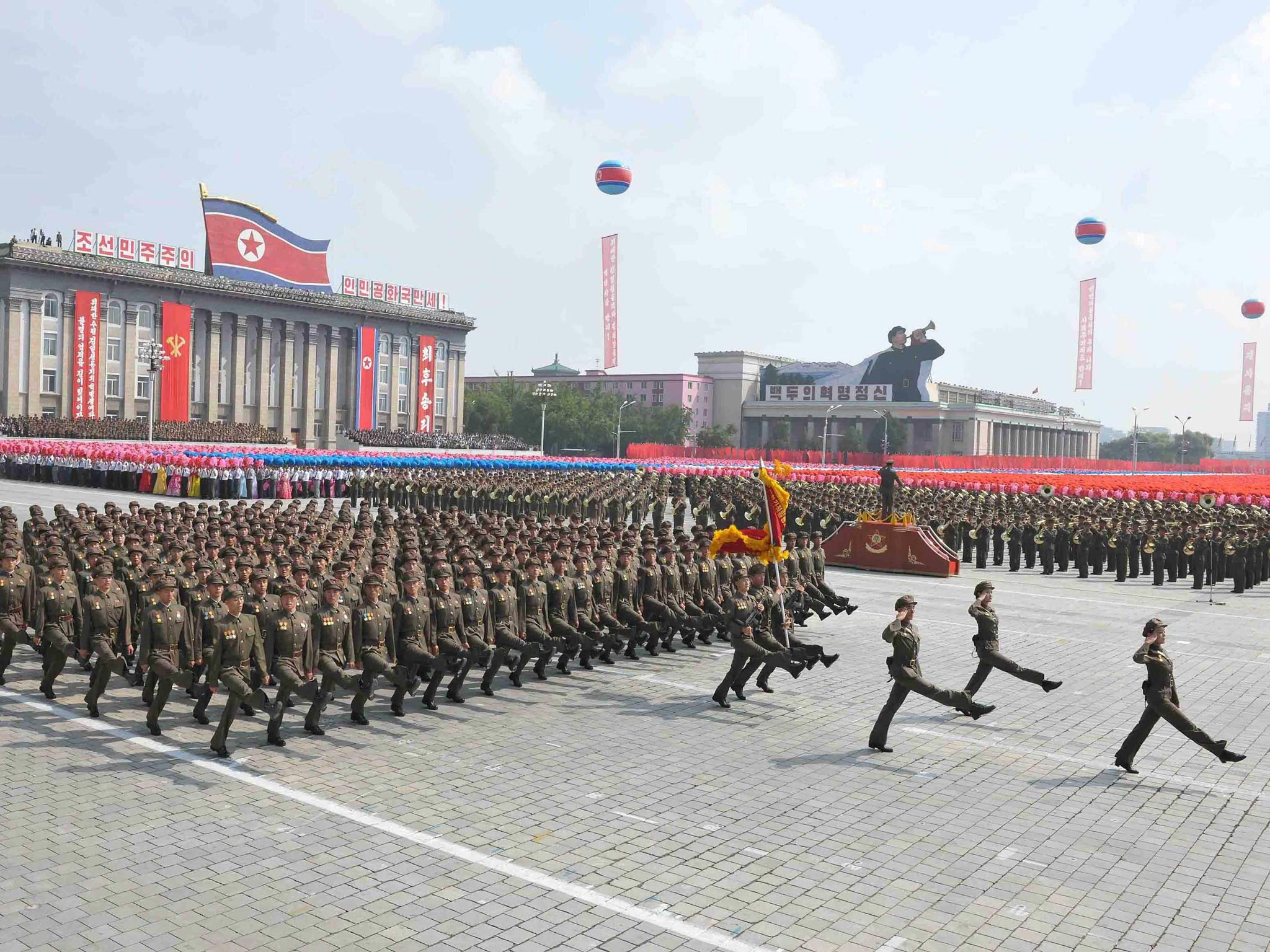 A parade of the Worker-Peasant Red Guards and a mass rally in Pyongyang in celebration of the 65th anniversary of North Korea