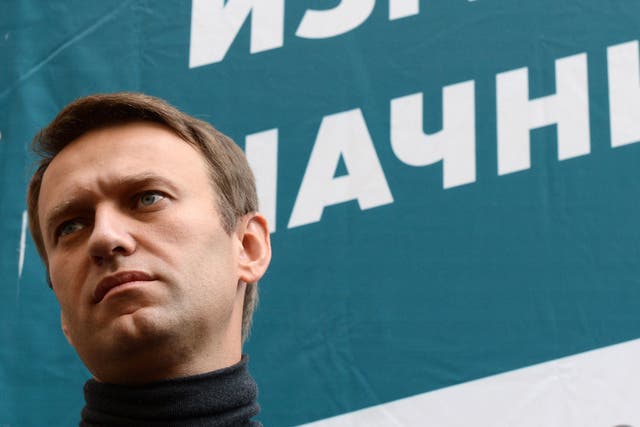 Alexei Navalny speaks to the press outside his headquarters in Moscow, Russia