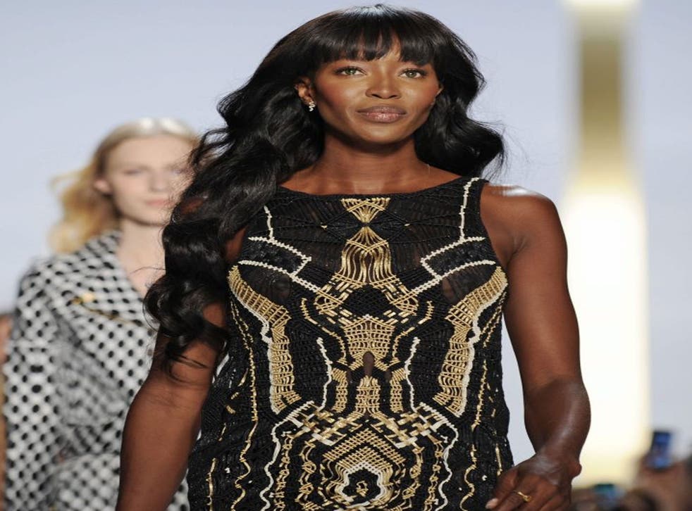 British super model Naomi Campbell presents a creation from the Spring 2014 collection by Diane Von Furstenberg (EPA)